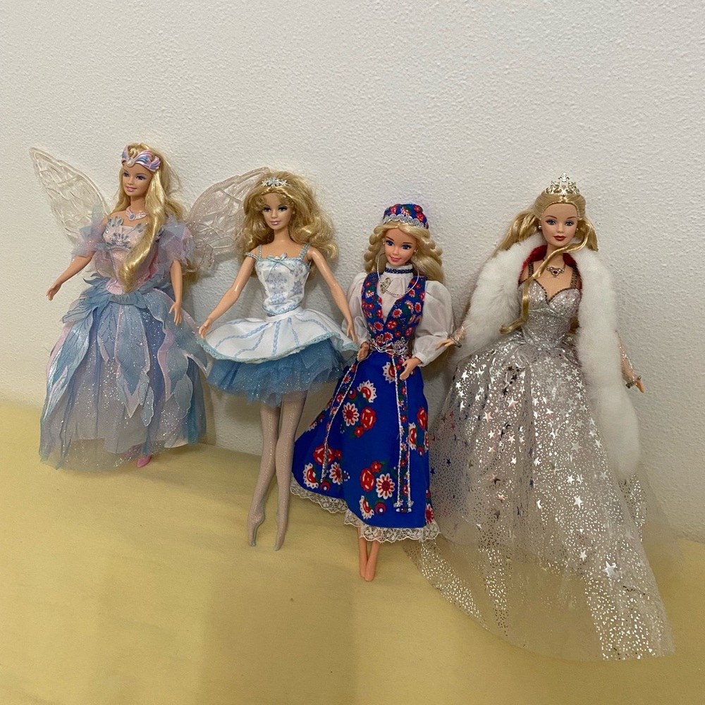 4 Barbie dolls